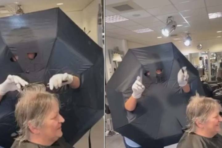 hairstylist use umbrella as shield from customer in netherlands salon