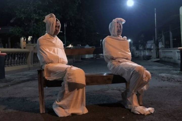 Coronavirus Indonesian village uses 'ghosts' for distancing patrols