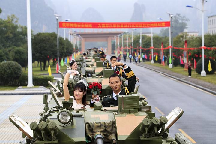 Newly-weds hold group wedding in military camp on Chinese National Day
