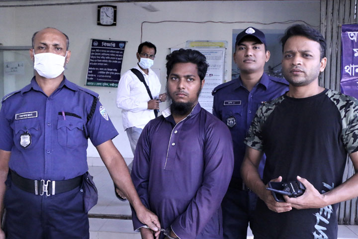 The accused madrasa teacher Mubarak Hossain with the police