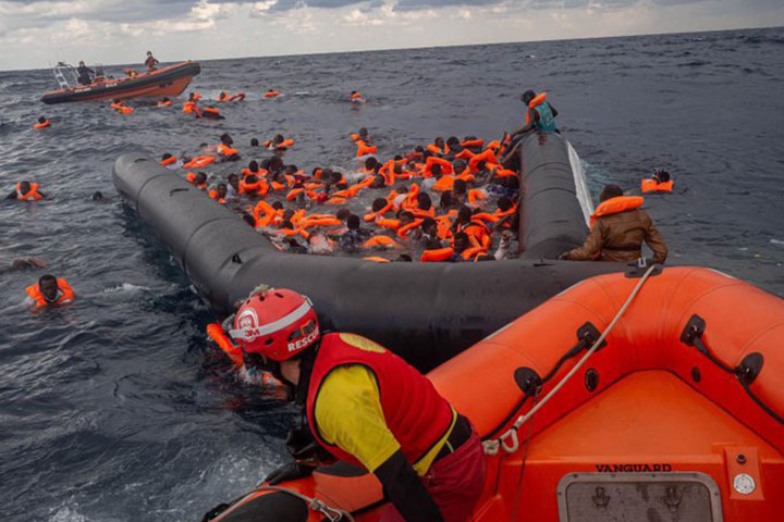 A boat capsizes off the coast of Libya, killing 74 refugees