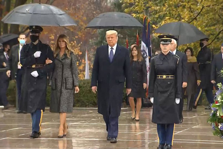 Melania grabbed the soldier's hand leaving Trump