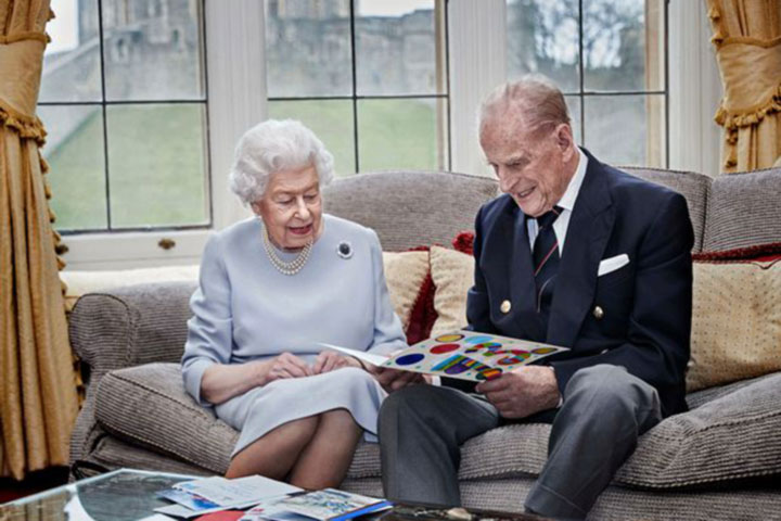 Queen and Prince Philip open 73rd wedding anniversary card made by George and Charlotte