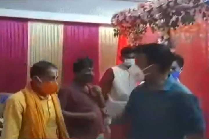 police entering the wedding beating the priest with sticks and arresting the bride and groom
