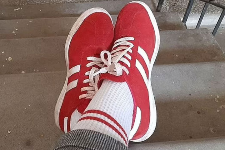 Woman is fined £650 for wearing red and white socks: Pedestrian punished in Belarus because her footwear matched colours of banned opposition flag