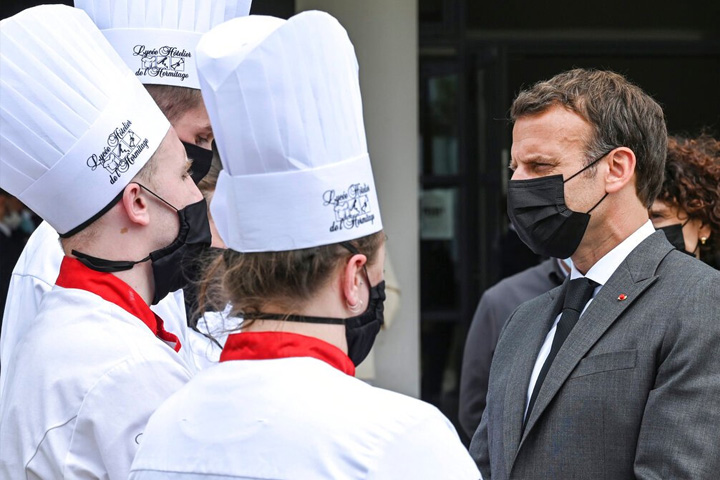 2 arrested after Macron slapped in face during walkabout
