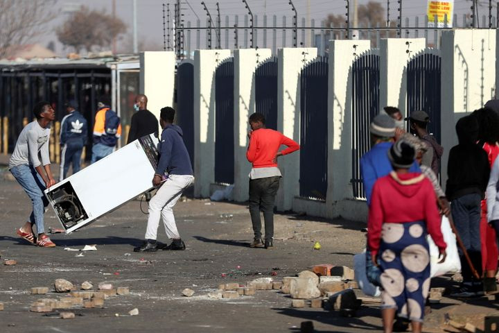 Protests in South Africa kill 45, shoplifting